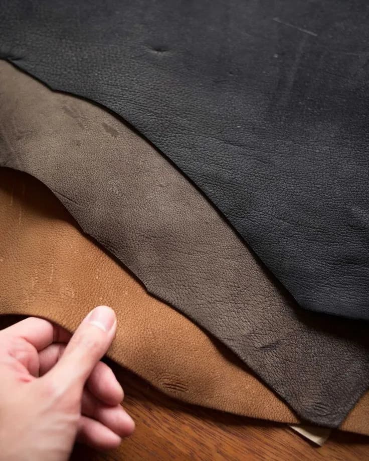Hand with three types of leather