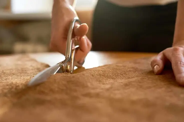 Craftsman working with suede